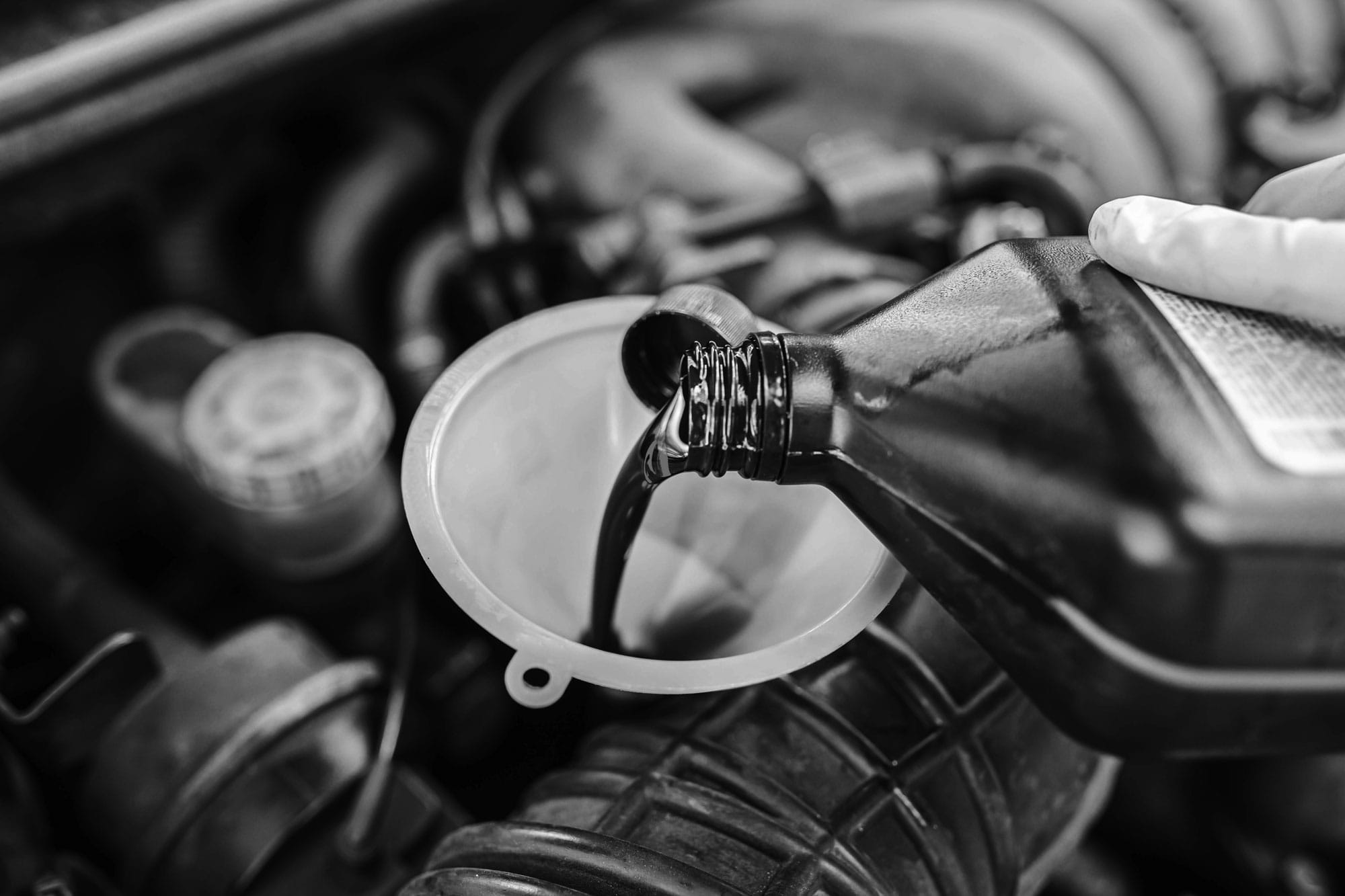 Gears-Pouring-Oil-Into-Funnel