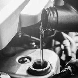 Pouring-oil-in-Car bw