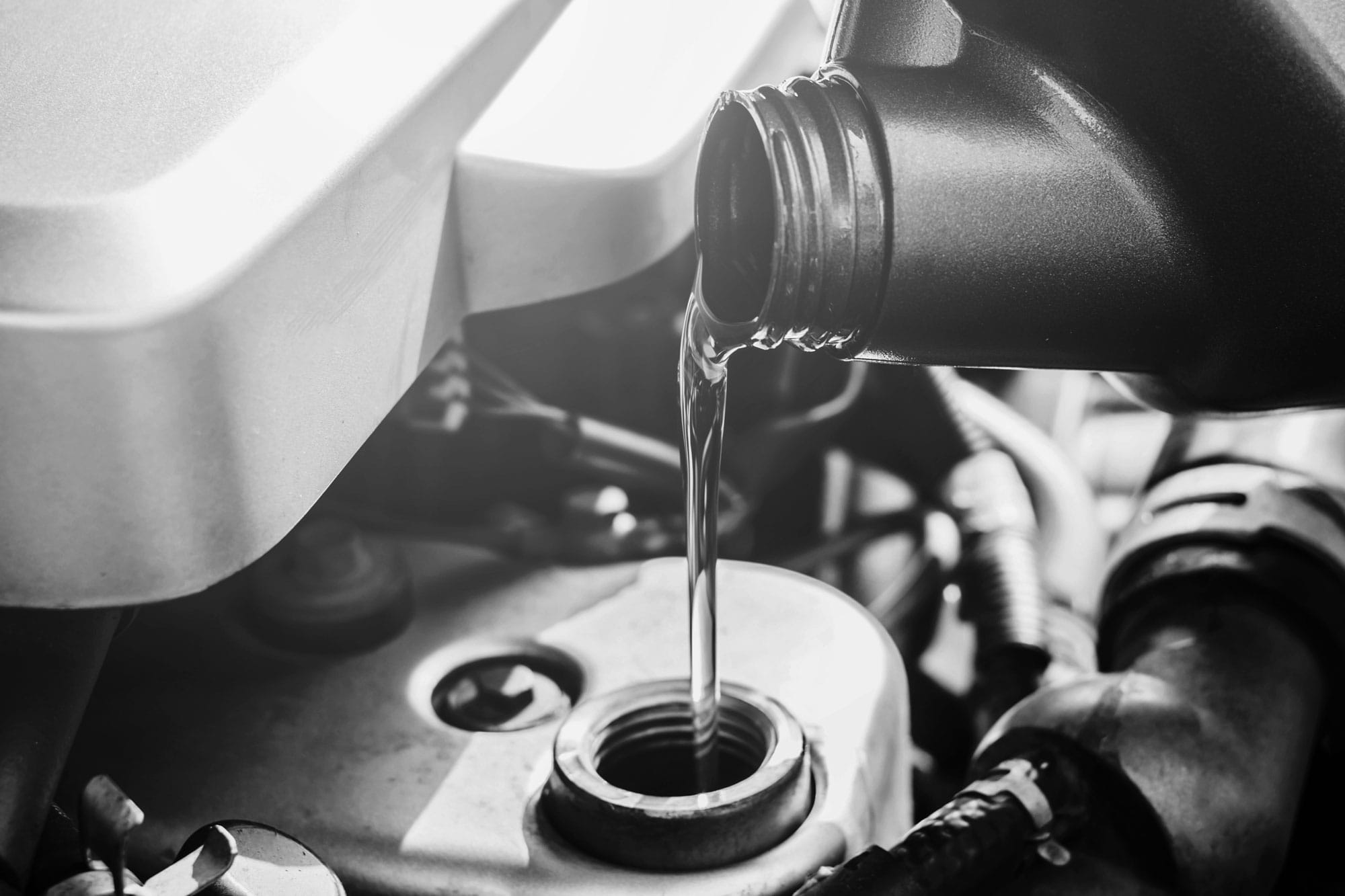 Pouring-oil-in-Car bw