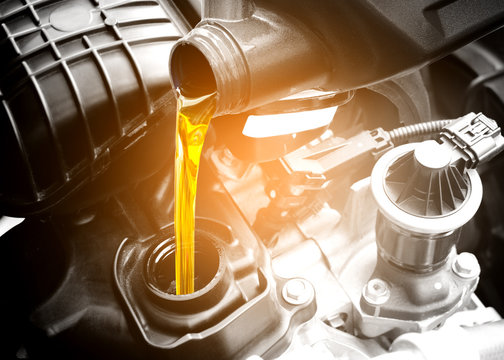 engine oil getting poured into a vehicle